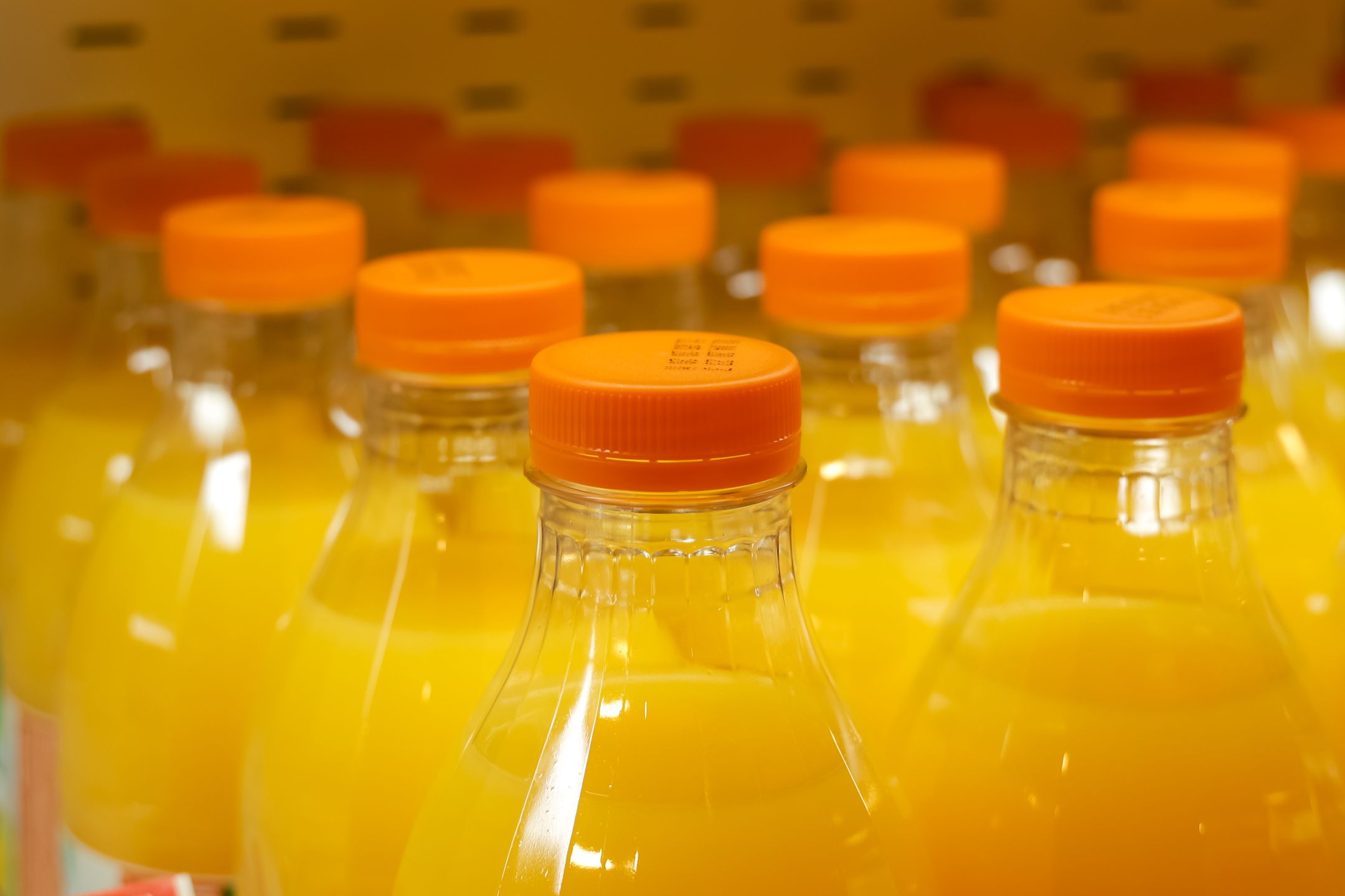 A lot of plastic bottles with orange juice on a store shelf. Close-up
A lot of plastic bottles with orange juice on a store shelf. Close-up
hodimzero
cap, plastic bottles, market