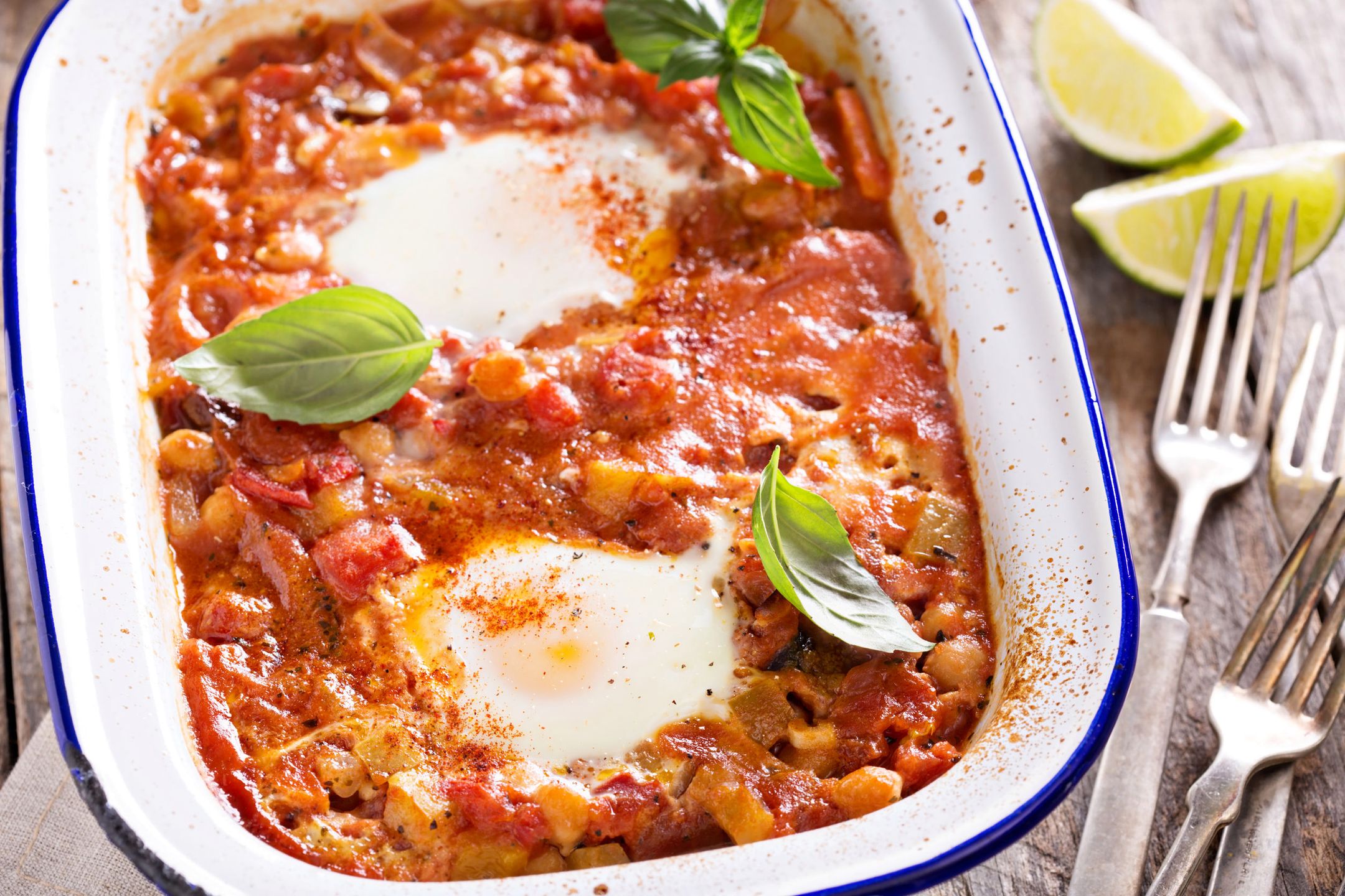 Huevos rancheros baked eggs with tomato sauce and chickpeas 