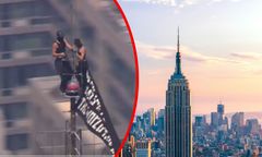 To ikoniczny budynek USA. Dwie osoby na szczycie Empire State Building