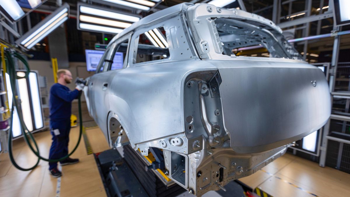 A worker polishes the body of a Mini Countryman automobile at the bodyshop in the BMW Group factory in Leipzig, Germany, on Thursday, March 21, 2024. New-vehicle registrations rose to 995,059 units last month, the European Automobile Manufacturers' Association said Thursday. Photographer: Krisztian Bocsi/Bloomberg via Getty Images