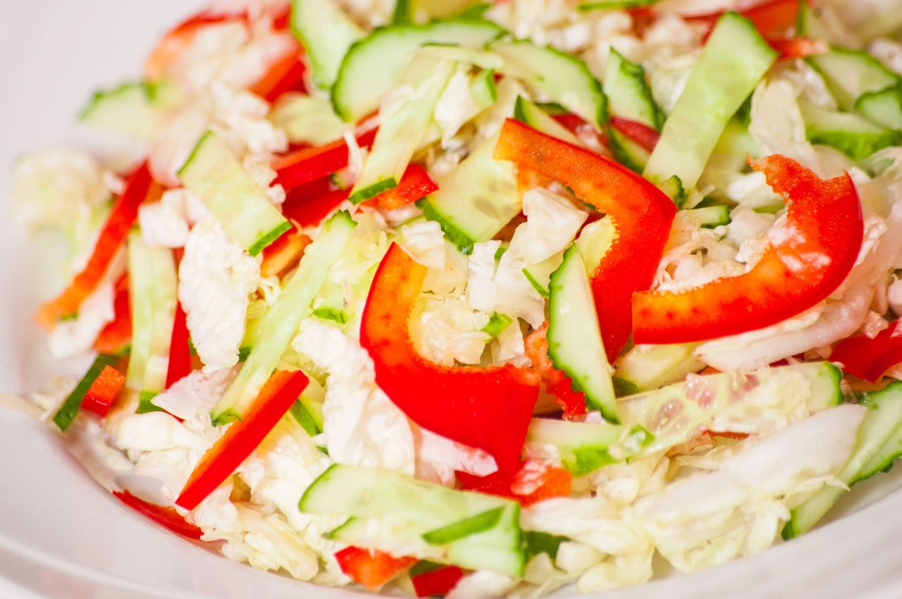 Drizzle the Chinese cabbage salad with a light dressing.