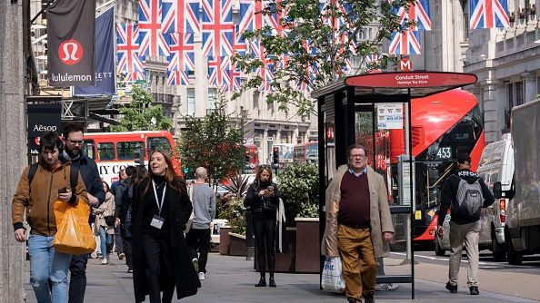 With just four days before the coronation of King Charles III, Union Jack flags hang above shoppers on Regent Street, on 3rd May 2023, in London, England. (Photo by Richard Baker / In Pictures via Getty Images)
Richard Baker