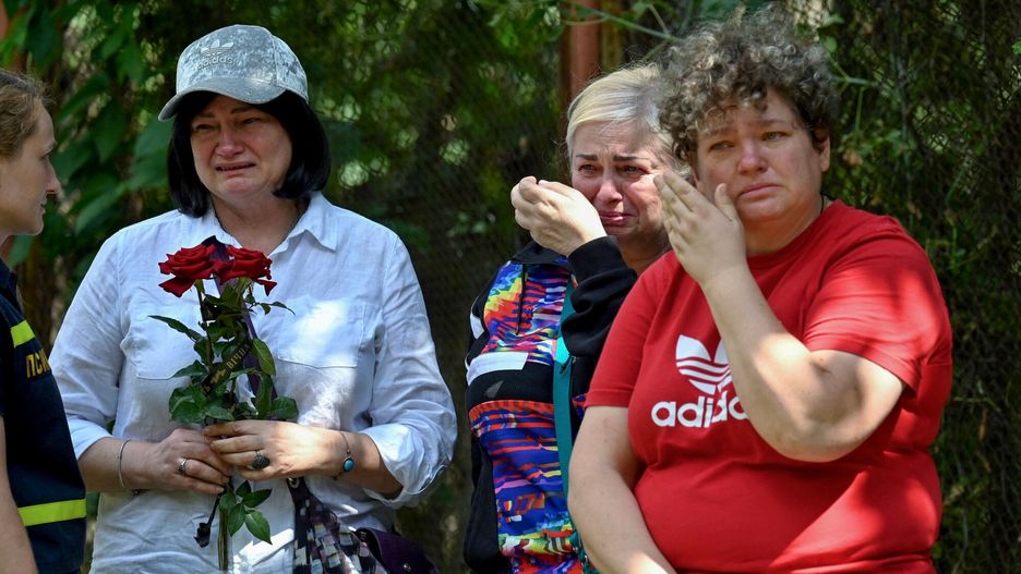 Temporary
Women cry in front of a residential building in Kyiv on August 1, 2025, partially destroyed following a Russian missile strike morning on July 31, 2025, amid Russian invasion in Ukraine. Kyiv observed a day of  mourning after the deadliest attack in the Ukrainian capital this year, which  ripped open a nine-storey residential building, wounding 159 people and claiming the lives of five children. (Photo by Sergei SUPINSKY / AFP)
SERGEI SUPINSKY