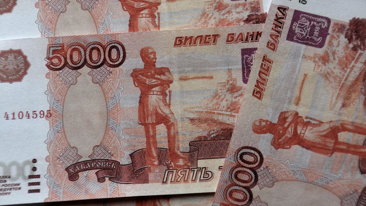 FRANCE - 2022/03/01: In this photo illustration, Russian banknotes of 5000 rubles seen displayed.The Russian ruble plunged almost 30% against the dollar after the invasion of Ukraine. The United States and the European Union had declared that they would exclude certain Russian banks from the international system of Swift banking payments. (Photo Illustration by Gerard Bottino/SOPA Images/LightRocket via Getty Images)