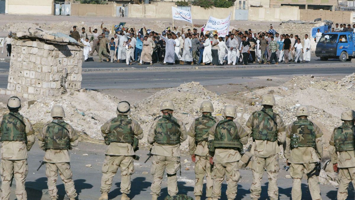 Truce Takes Hold Between Shiite Militia And U.S. Military In Najaf, Iraq
NAJAF, IRAQ - AUGUST 13: American soldiers of the 1st Cavalry Division 2nd Battalion 7th Cavalry watch a peaceful rally in support of Iraqi cleric Moqtada al-Sadr march past their position August 13, 2004 in Najaf, Iraq. Shiite militia fighters that have been battling U.S. troops seemed to observe a truce, as the city remained quiet.
Joe Raedle