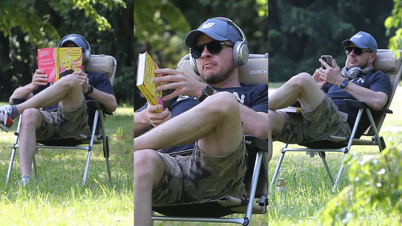 Filip Chajzer relaksuje się w parku