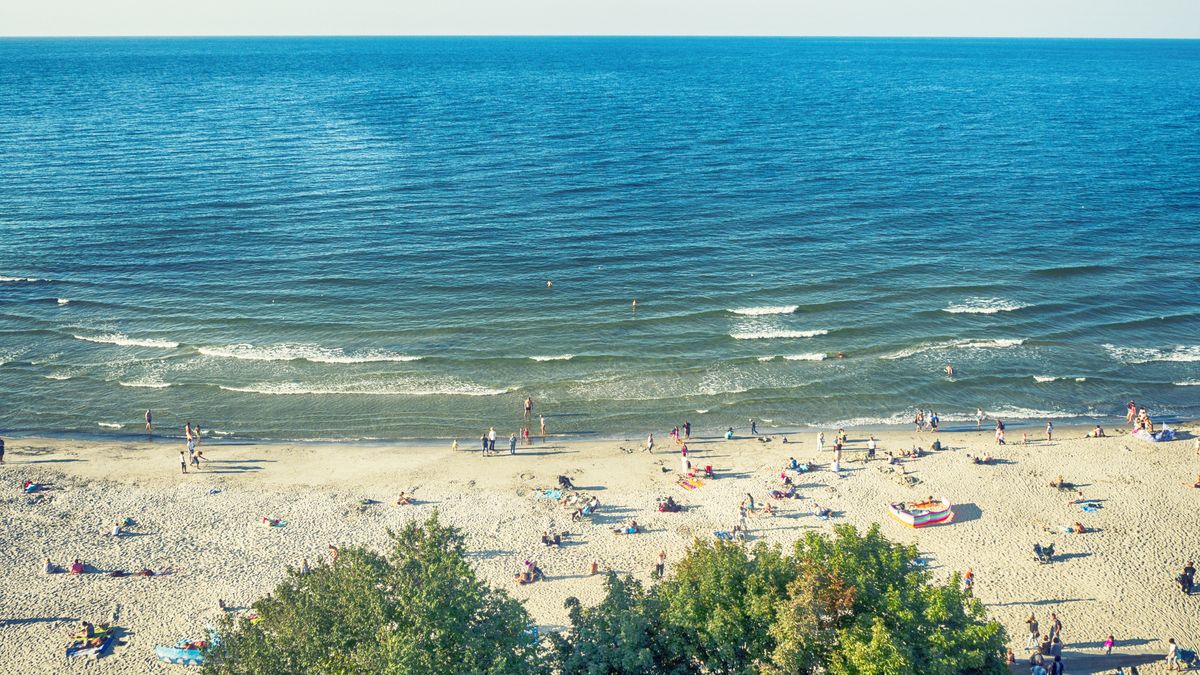 Aerial view of people on beach along the Baltic Coast, PolandKiraadults, blue sky, children, holiday, ravel destinations, relaxing, unrecognizable people