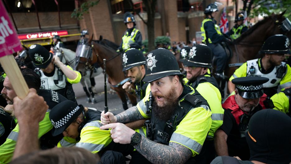 Mounted police officers scuffle with demonstrators during a protest by Abolish Asylum System and counter protesters at Castle Park in Bristol. Picture date: Saturday August 23, 2025. (Photo by Ben Birchall/PA Images via Getty Images)