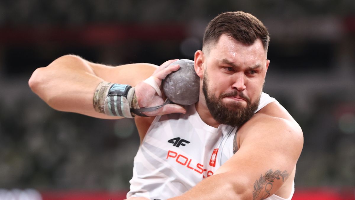 TOKYO, JAPAN - AUGUST 03: Konrad Bukowiecki of Team Poland competes in the Men's Shot Put qualification on day eleven of the Tokyo 2020 Olympic Games at Olympic Stadium on August 03, 2021 in Tokyo, Japan. (Photo by Ryan Pierse/Getty Images)
