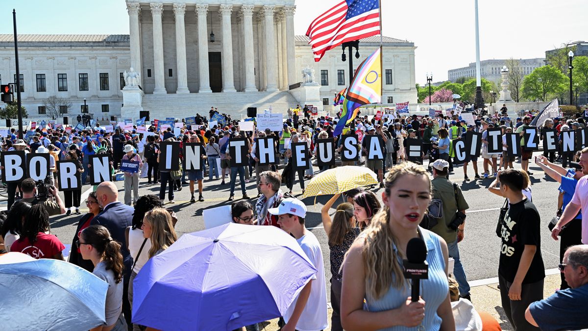 Demonstrators hold a "Born In The USA Equals Citizen" sign outside the US Supreme Court in Washington, DC, US, on Wednesday, April 1, 2026. President Donald Trump is fighting to end automatic citizenship for children born to parents who are in the country unlawfully or on temporary visas, part of his broader crackdown on undocumented immigrants and a change that could overturn more than a century of legal precedent. Photographer: Graeme Sloan/Bloomberg via Getty Images