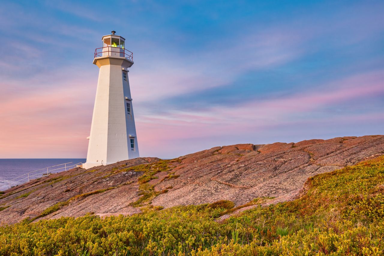 Stock photograph of the landmark Cape Spear Lighthouse near St John's, Newfoundland, Canada at sunset. Cape Spear is the most easterly point in Canada.