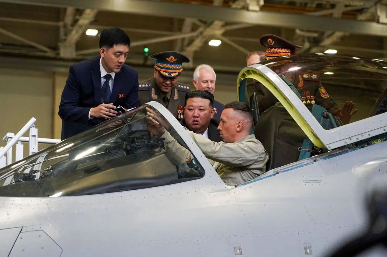 Kim Jong Un conducts an inspection of the Russian Su-57 airplane.