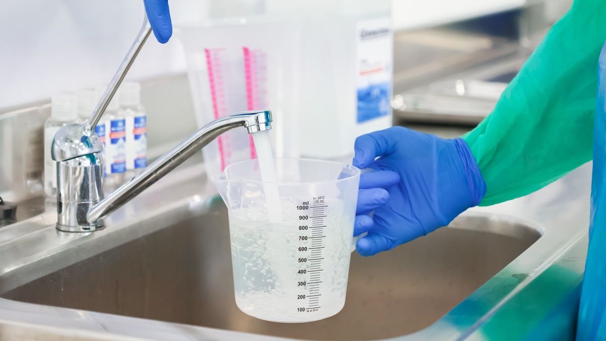 A laboratory worker in protective gear fills a plastic measuring cup with water at a stainless steel sink for precise liquid preparation tasks within a clean clinical facility
A technician wearing blue latex gloves fills a graduated container under a faucet to measure fluids accurately for chemical mixing or sanitation protocols in a professional lab
hantavirus, covid 19, laboratory, science, research, chemistry, water, liquid, measurement, glove, protection, safety, technician, worker, sink, tap, plastic, beaker, clinical, hygiene, sanitation, preparation, fluid, medical, scientific, analysis, experiment, professional, facility, procedure, sterile, industry, work, task, precision, graduated, container, stainless, steel, testing, pharmacy, cleaning, disinfection, scrub, healthcare, operator, hand, blue, green, gown, hantavirus, covid 19, laboratory, science, research, chemistry, water, liquid, measurement, glove, protection, safety, technician, worker, sink, tap, plastic, beaker, clinical, hygiene, sanitation, preparation, fluid, medical, scientific, analysis, experiment, professional, facility, procedure, sterile, industry, work, task, precision, graduated, container, stainless, steel, testing, pharmacy, cleaning, disinfection, scrub, healthcare, operator, hand, blue, green