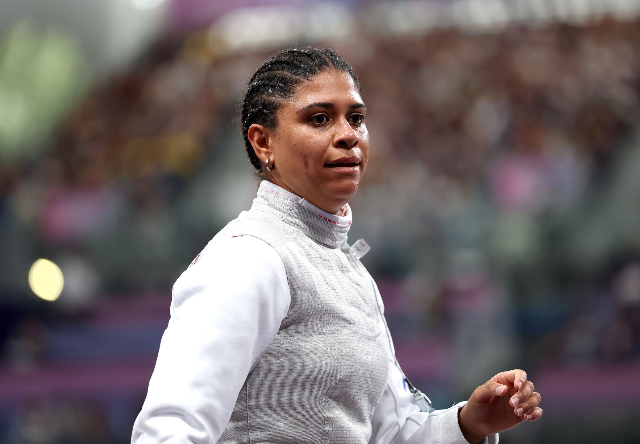 PARIS, FRANCE - JULY 28: Ysaora Thibus of Team France reacts after her defeat against Julia Walczyk-Klimaszyk of Team Poland in the Fencing Women's Foil Individual Table of 32 on day two of the Olympic Games Paris 2024 at Grand Palais on July 28, 2024 in Paris, France. (Photo by Patrick Smith/Getty Images)