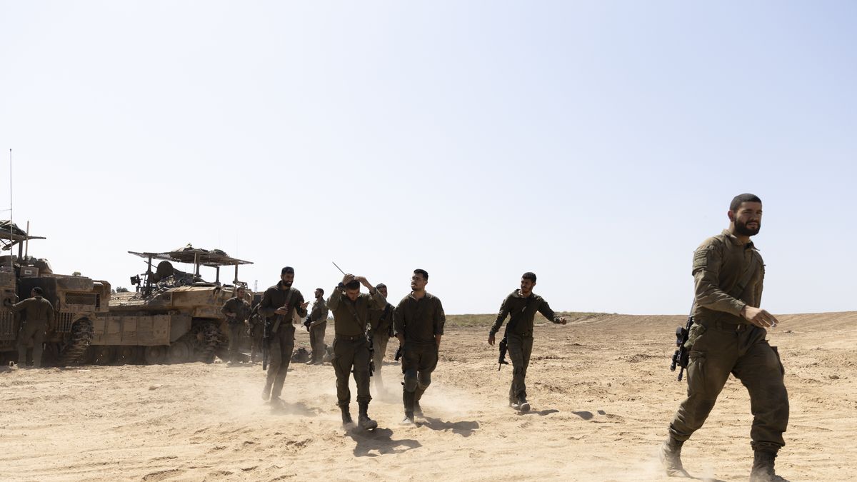 SOUTHERN ISRAEL, ISRAEL - APRIL 15: Israeli soldiers prepare before entering into the Gaza Strip on April 15, 2024 in Southern Israel, Israel. Israel's allies, including the UK and US, have urged the country to avoid escalation of conflict with Iran after it launched hundreds of missiles and drones at Israel over the weekend. Meanwhile, foreign mediators in the conflict continue to push for a ceasefire in the war in Gaza and an increase in distribution of humanitarian aid there.(Photo by Amir Levy/Getty Images)