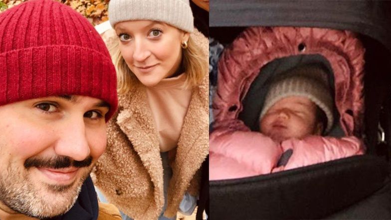 Lara Gessler z mężem i córką pozują na spacerze