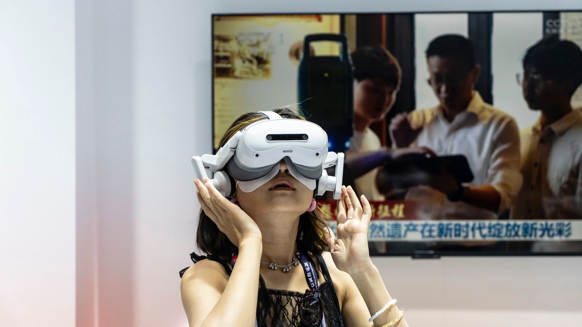 An attendee tries a virtual reality (VR) headset at the MWC Shanghai tech show in Shanghai, China, on Thursday, June 19, 2025. The show runs through June 20. Photographer: Qilai Shen/Bloomberg via Getty Images