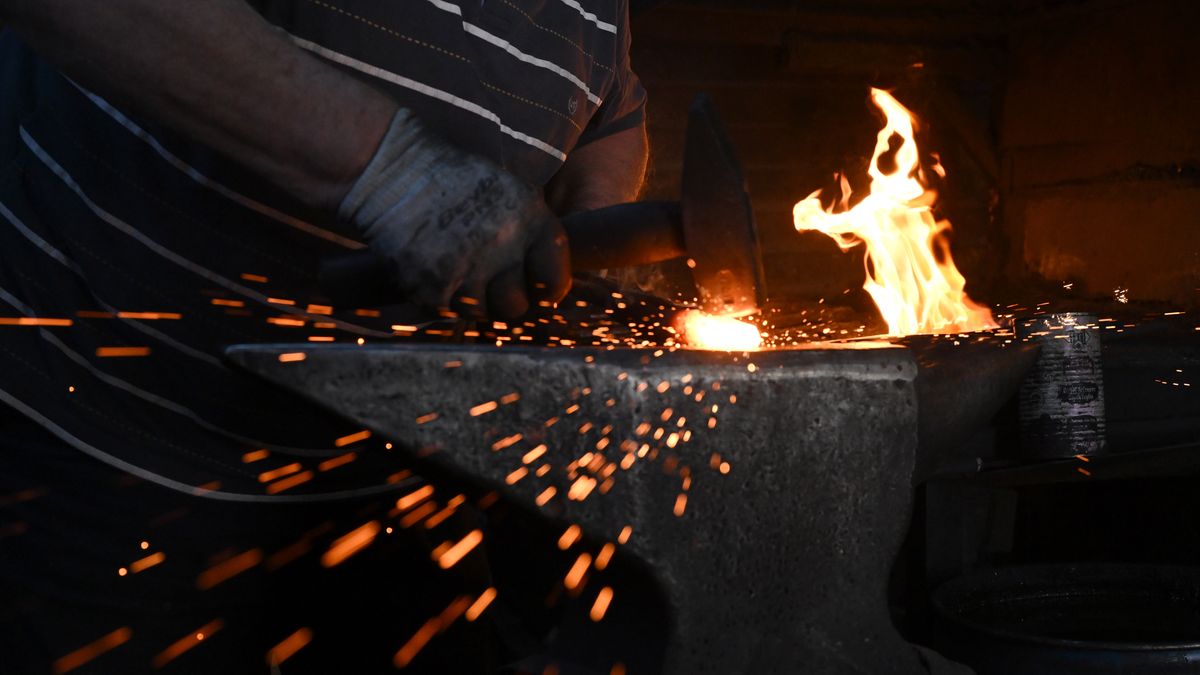 ANKARA, TURKIYE - SEPTEMBER 19: Turhan Eskitoros, a 74-year-old smith who has been forging iron for the last fifty years practices his craft in his 50 square meter shop at Ulus district of Ankara, Turkiye on September 19, 2023. Eskitoros manufactures tools for constructions and gardening such as axes, cleavers, and hammers. (Photo by Mehmet Ali Ozcan/Anadolu Agency via Getty Images)