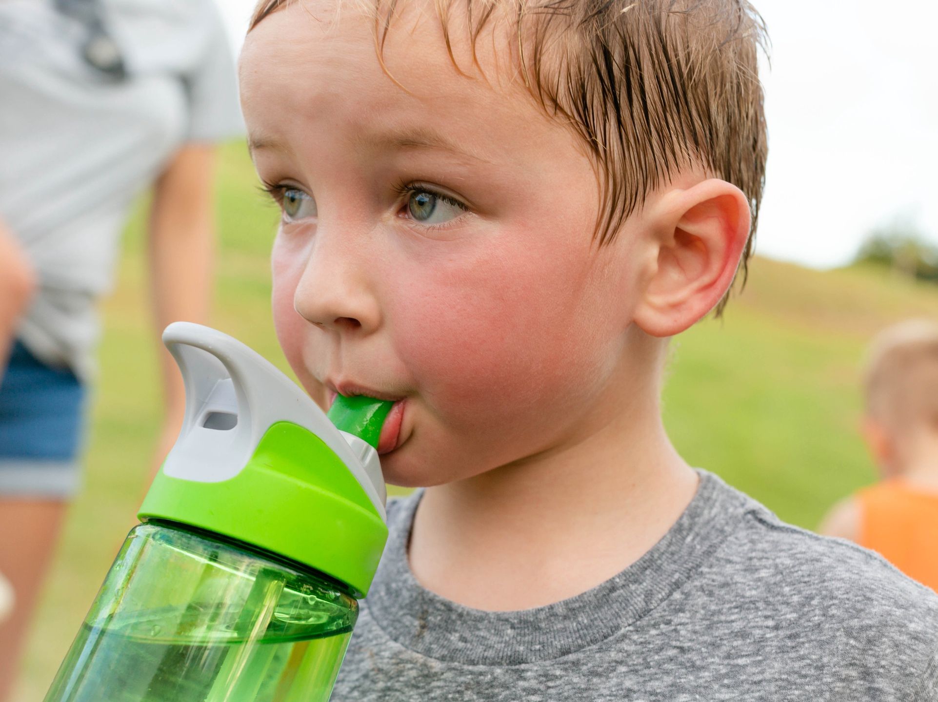 Children drinking water. A thirsty boy taking a water break after playing outdoor.
A young boy taking a break from vigorous exercise and playing outside, drinking water and sweating.
globalmoments
activity, quench, h20