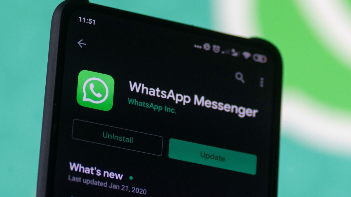 WhatsApp logo displayed on a phone screen, smartphone and keyboard are seen in this multiple exposure illustration. WhatsApp Messenger is a multiplatform mobile application that provides an encrypted instant messaging system belonging to Facebook, photo taken in Amsterdam, Netherlands on January 28, 2020 (Photo illustration by Nicolas Economou/NurPhoto via Getty Images)