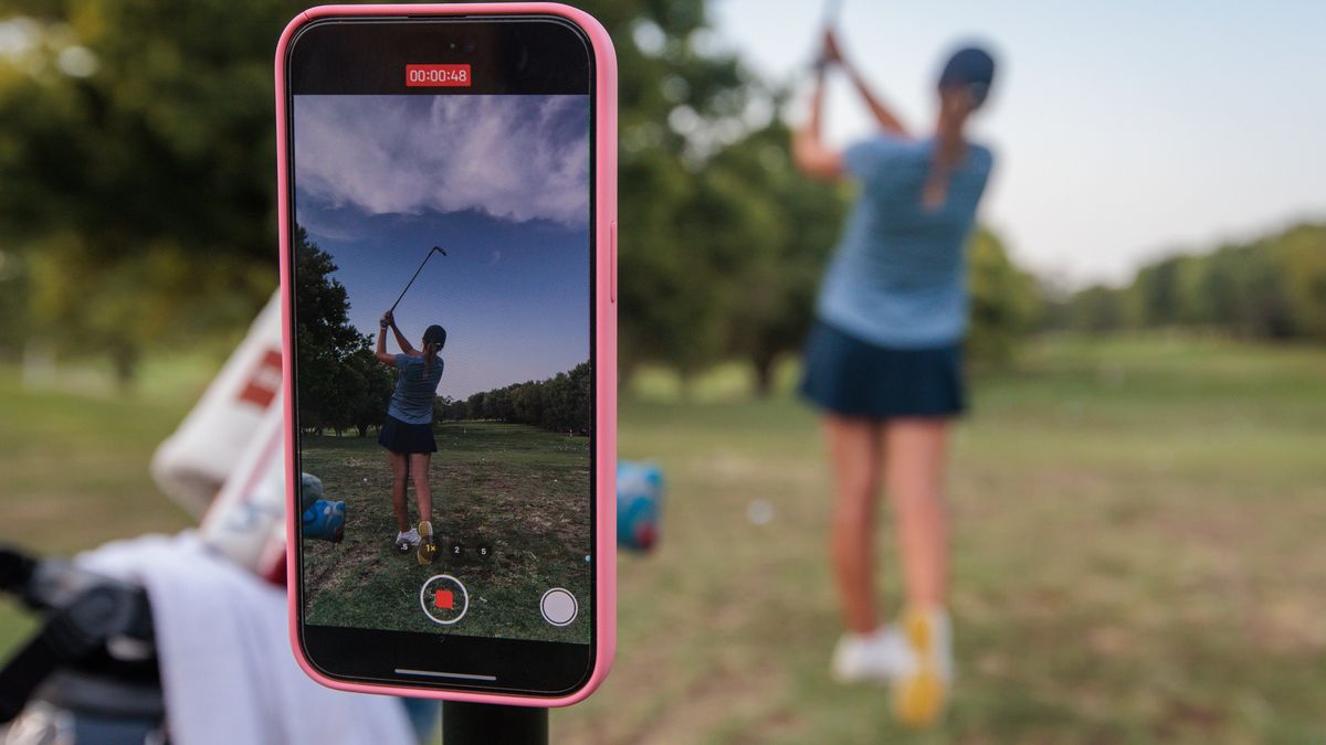 WICHITA, KANSAS - AUGUST 2: Bobbie Stricker uses her iPhone to record driving practice during the second round of the ANNIKA Women's All Pro Tour: Heritage Classic at Rolling Hills Country Club on August 2, 2024 in Wichita, Kansas. (Photo by William Purnell/Getty Images)