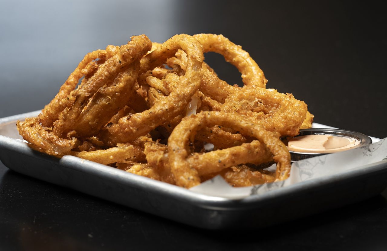 WESTBROOK, ME - DECEMBER 1: House made onion rings with a sriracha ranch dip at George and Leon's in Westbrook, photographed on Friday, December 1, 2023. (Staff photo by Gregory Rec/Portland Press Herald via Getty Images)