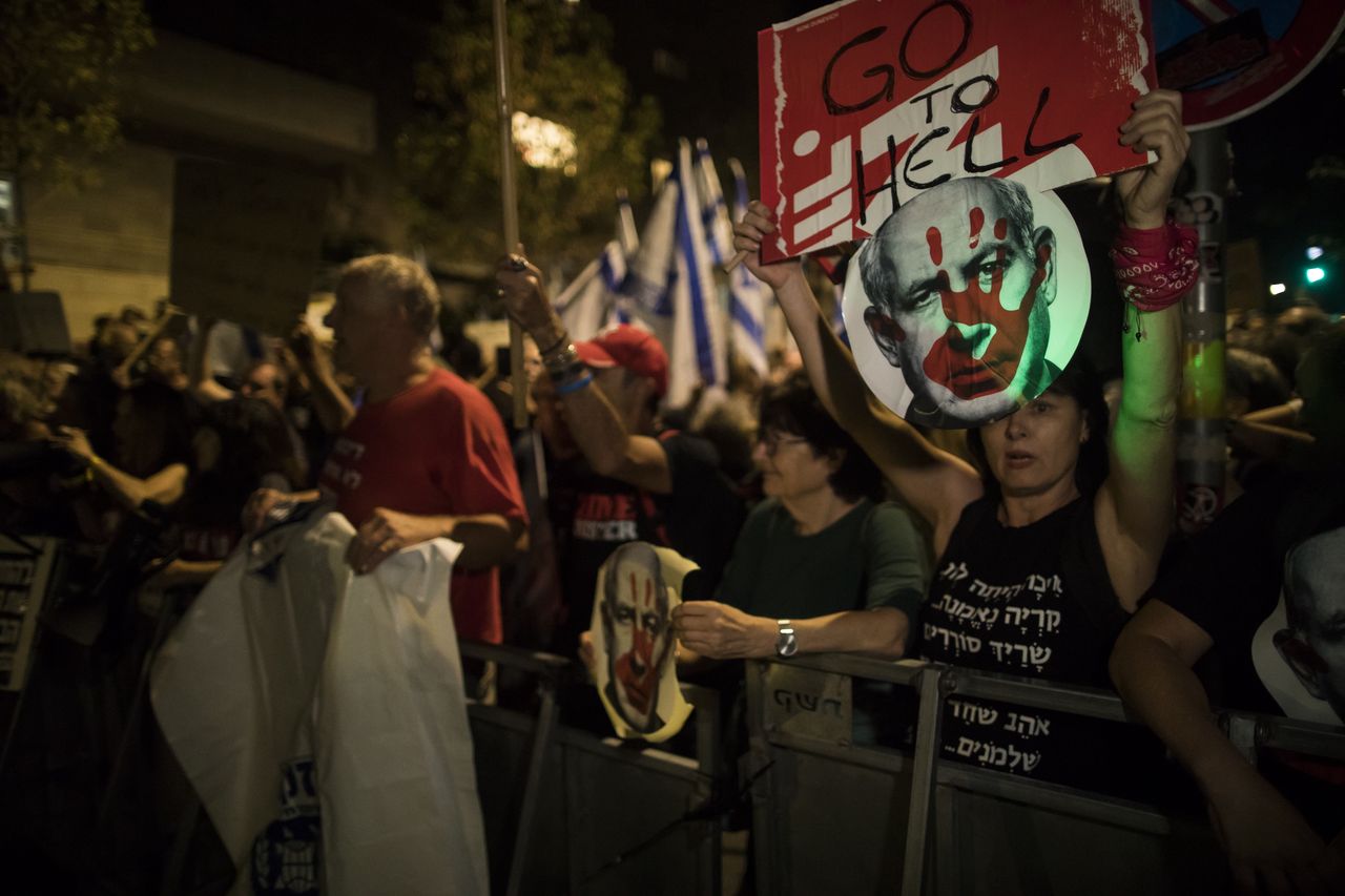 Protesters rally outside Netanyahu's residence. They demand his resignation