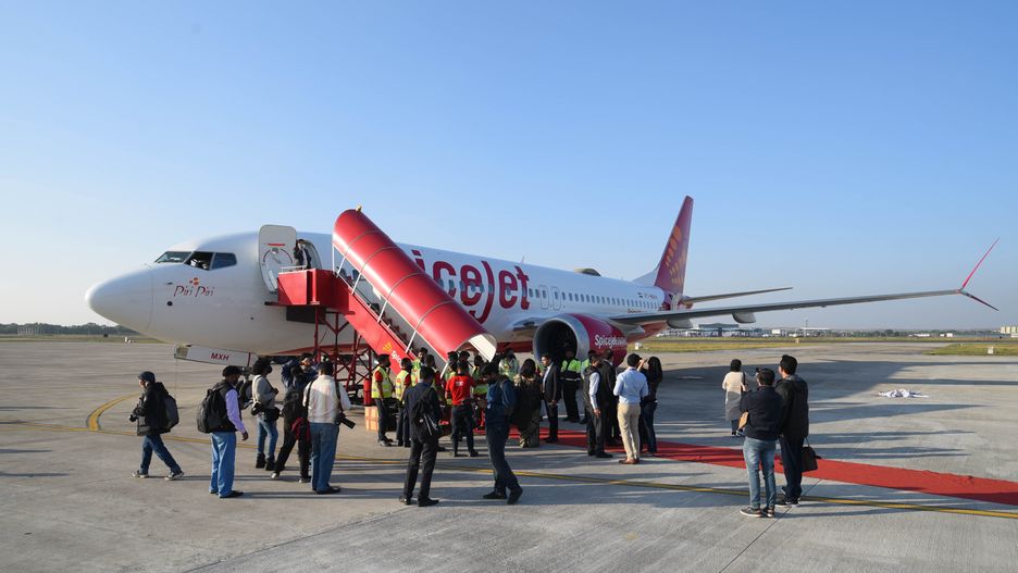 NEW DELHI, INDIA - NOVEMBER 23: A view of SpiceJet Boeing 737 MAX   on November 23, 2021 in New Delhi, India. SpiceJet has brought back Boeing 737 MAX aircraft into operation after a gap of more than two years with a special flight from New Delhi to Gwalior on November 23. This comes almost a week after the domestic carrier said it has entered into an agreement with the US-based aerospace company Boeing to settle outstanding claims related to the grounding of 737 Max aircraft and its return to service.  (Photo by Amal KS/Hindustan Times via Getty Images)