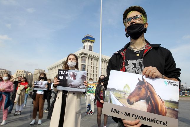 KIEV, UKRAINE - 2020/10/04: An activist holding an animal rights placard during the demonstration.At Independence Square, animal rights activist demand a ban on hunting and fur farms, testing on animals, using animals in circuses, contact zoos, dolphinariums, and also begging with animals. The protest marked World Animal Day, an international day of action for animal rights and welfare celebrated annually on 4 October. (Photo by Pavlo Gonchar/SOPA Images/LightRocket via Getty Images)