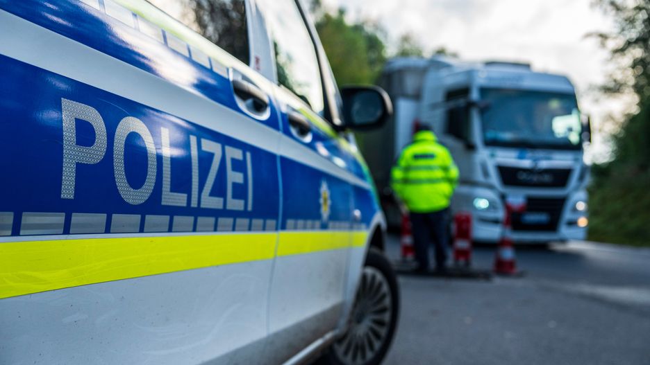 A police officer monitors vehicles crossing the Czech Republic-Germany border in Ulrichsberg, Germany, on Tuesday, Sept. 17, 2024. A temporary extension of border controls to all of Germany's nine land frontiers took effect on Monday, part of an enhanced effort to tackle irregular migration and people smuggling that has irritated some of its neighbors. Photographer: Milan Jaros/Bloomberg via Getty Images