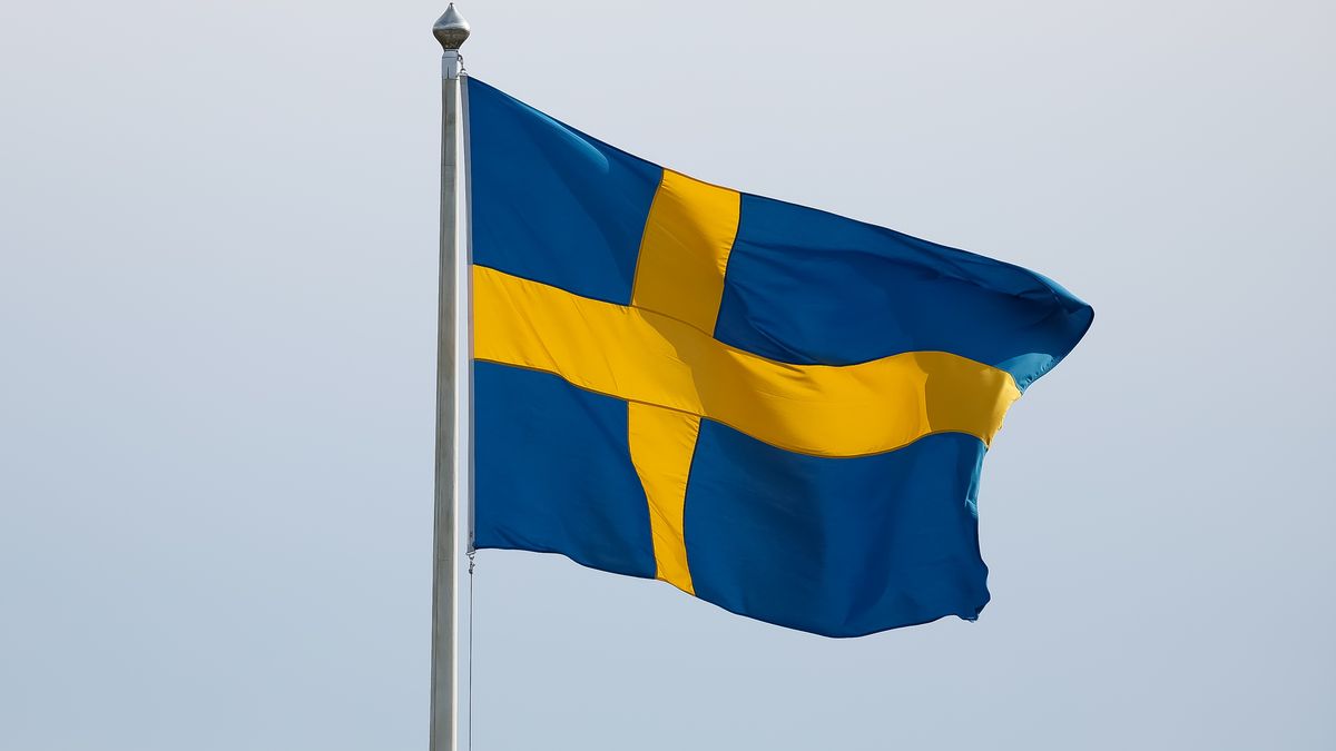 STOCKHOLM, SWEDEN - JUNE 06: The Swedish flag during ceremony celebrating Sweden's national day at Skansen on June 06, 2022 in Stockholm, Sweden. (Photo by Michael Campanella/Getty Images)