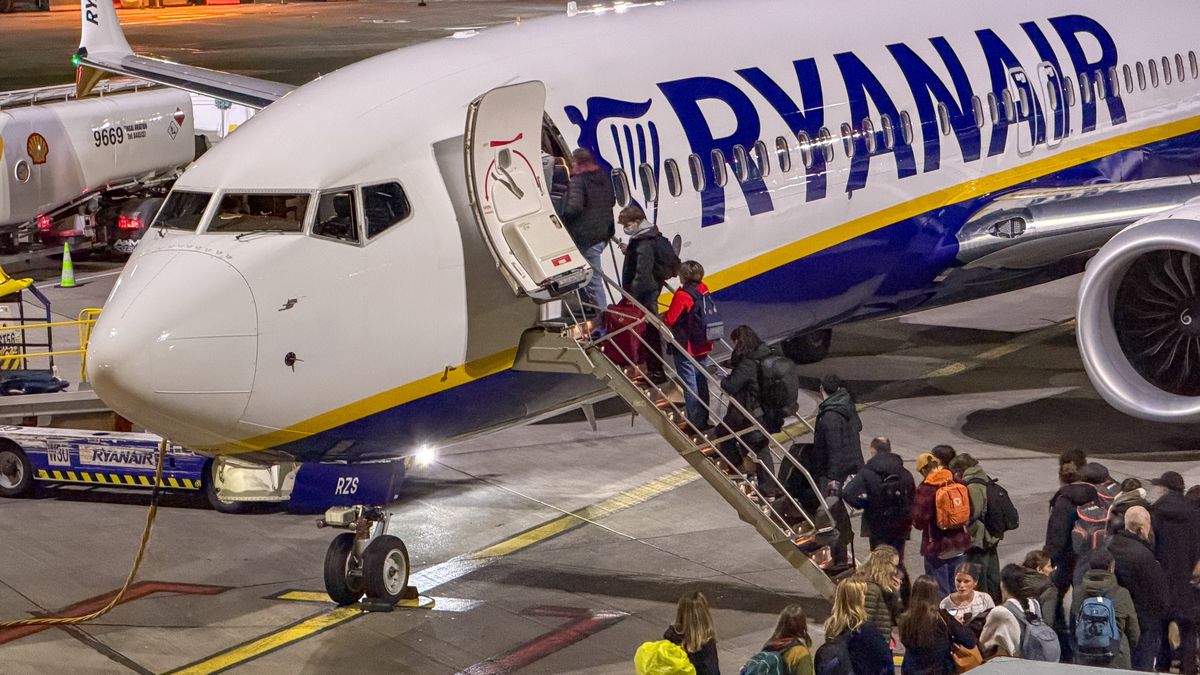 DUBLIN, IRELAND - NOVEMBER 01: Passengers board a Ryanair aircraft that is parked on the runaway at Dublin Airport, on November 1, 2025 in Dublin, Ireland. With projections for passenger traffic to more than double by 2050, aviation carbon emissions are projected to increase, especially in relation to other sectors as their emissions decline. Global commitments to reducing future Co2 carbon emissions will mean a huge investment is needed in green and renewable energy sources and infrastructure such as solar and wind farms so that economies can transition from getting energy from carbon and fossil fuels to that generated by clean sources. (Photo by Matt Cardy/Getty Images)