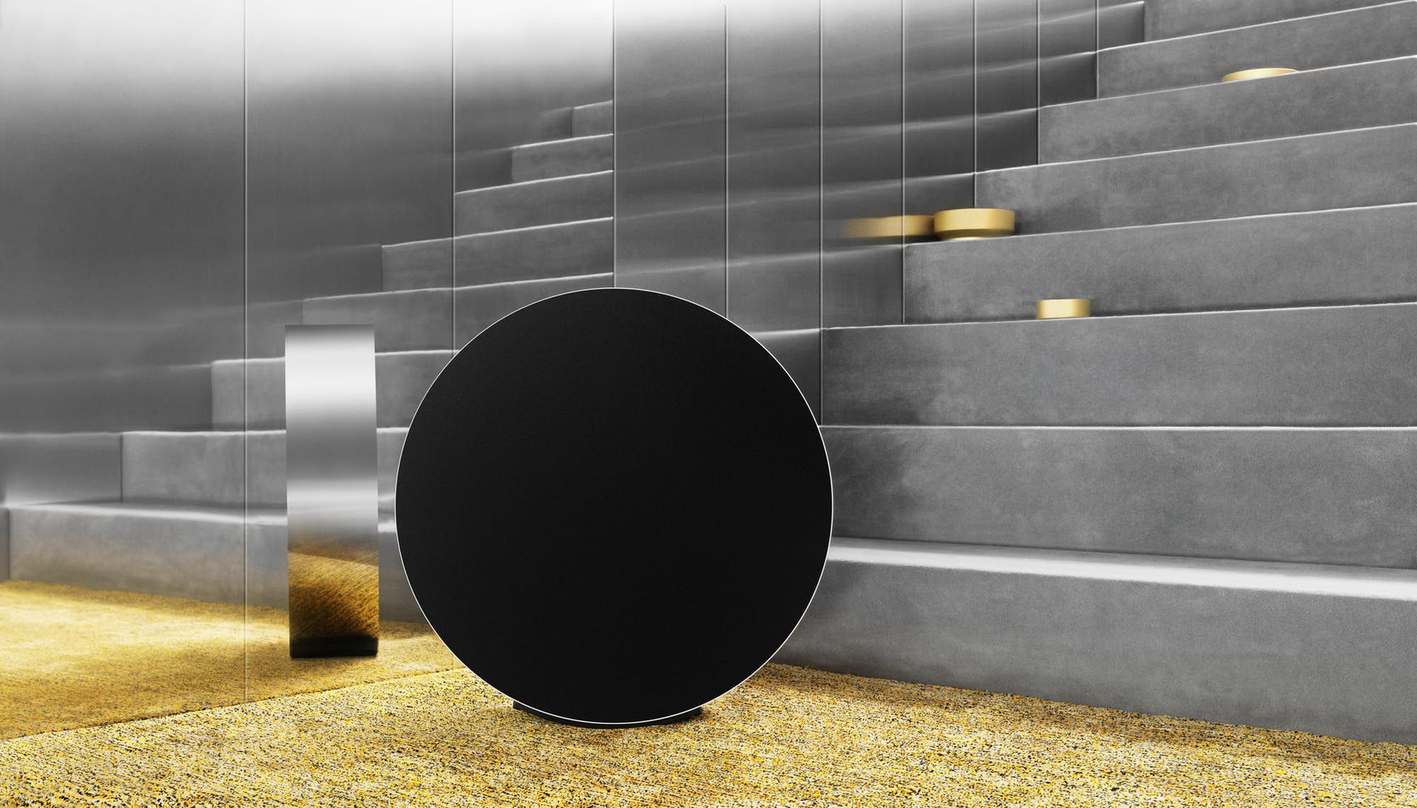 Okrągły głośnik Bang & Olufsen Edge. Aby sterować muzyką, przetocz go po podłodze 2
