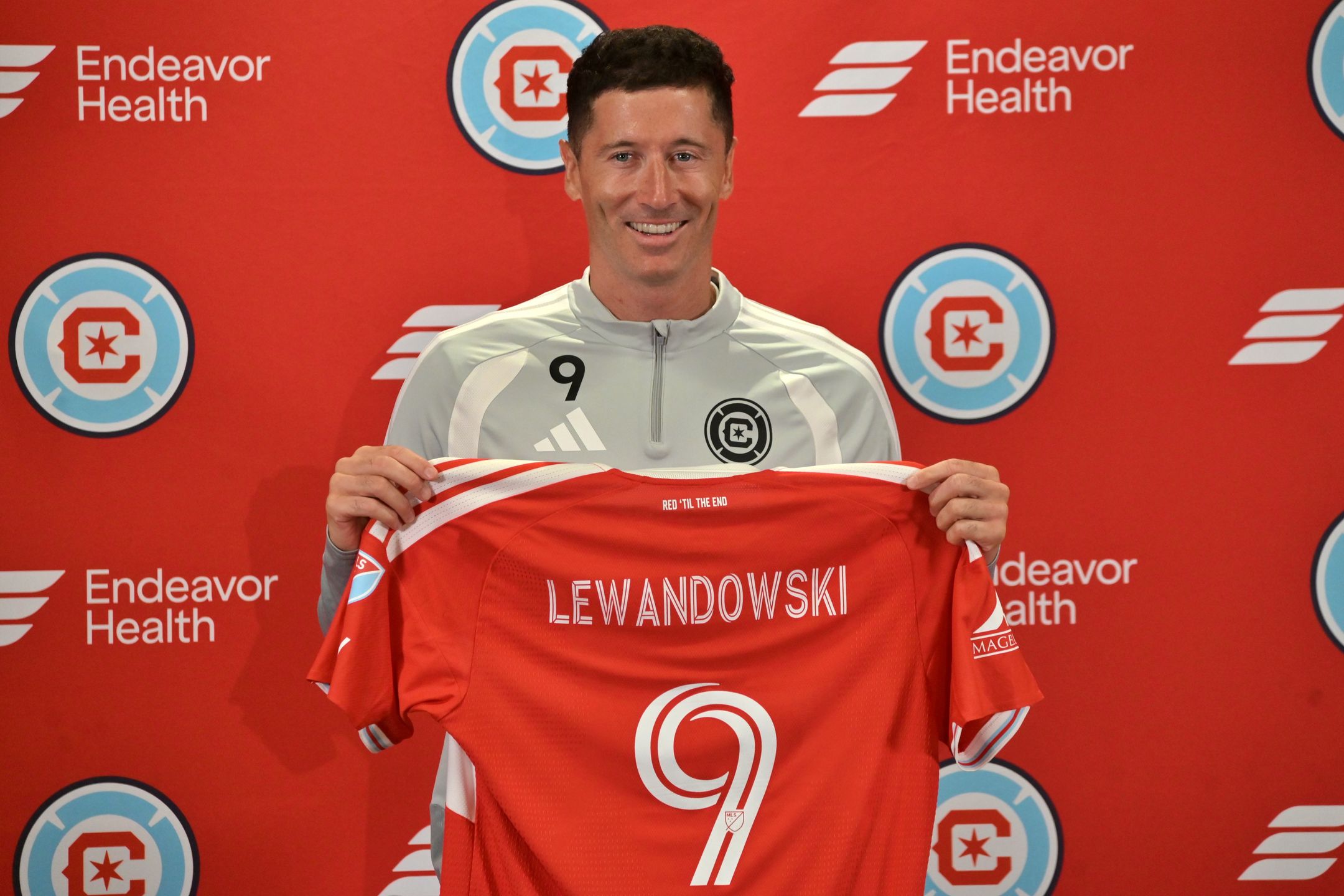 CHICAGO, ILLINOIS - JULY 14: Robert Lewandowski (9) poses with a jersey after being introduced by the Chicago Fire FC at a press conference at Endeavor Health Performance Center in Chicago, Illinois on July 14, 2026. (Photo by Jacek Boczarski/Anadolu via Getty Images)