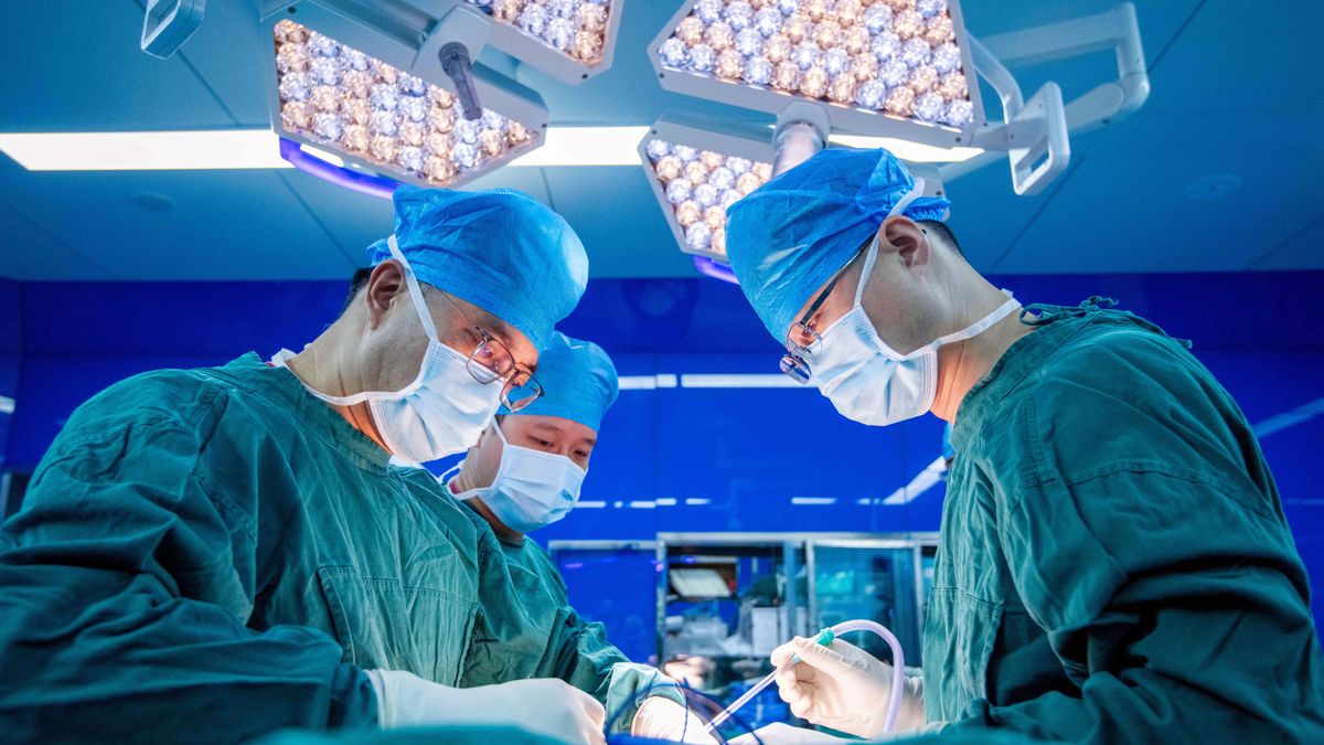 TAIZHOU, CHINA - AUGUST 19: Surgeons perform a surgery on a patient at the Taizhou Hospital of TCM on August 19, 2025 in Taizhou, Jiangsu Province of China. Chinese Doctors' Day is celebrated annually on August 19. (Photo by VCG/VCG via Getty Images)