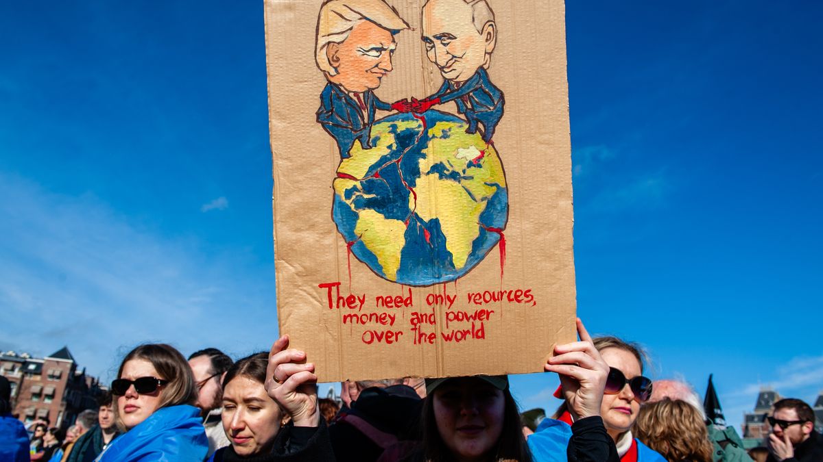 AMSTERDAM, NETHERLANDS - 2025/02/23: A view of an illustration of Putin and Trump running the world during the demonstration. In Amsterdam, thousands of Ukrainian people, supporters, and Ukrainian soldiers gathered to remind society that the war must end and that Ukraine needs support. Over eight million people have been forced to leave Ukraine, and another five million have been internally displaced following Russia's invasion of Ukraine three years ago. (Photo by Ana Fernandez/SOPA Images/LightRocket via Getty Images)