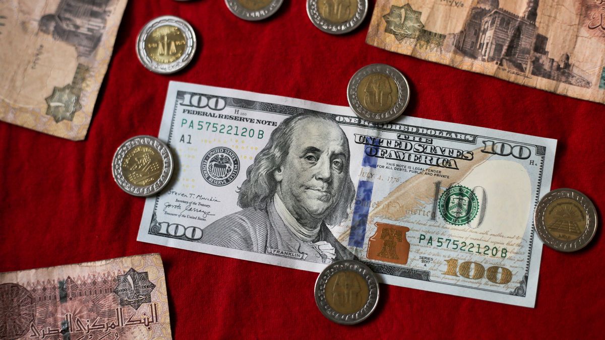 CAIRO, EGYPT- JANUARY 5: In this photo illustration, a selection of Egyptian pounds, Egyptian banknotes, and US dollars are shown on January 5, 2023 in Cairo, Egypt. The Egyptian pound suffered its biggest one-day drop on January 4 since the cash-strapped government agreed to a 3 billion USD deal with the International Monetary Fund in mid-December 2022, authorities said. Since the beginning of 2022, the Egyptian pound has lost more than 60 percent of its value against the dollar. Egypt's economy has been hit hard by years of government austerity, the coronavirus pandemic and the fallout from the war in Ukraine. Egypt is the world's largest wheat importer, with most of its imports traditionally coming from Eastern Europe.(Photo by Fadel Dawod/Getty Images)