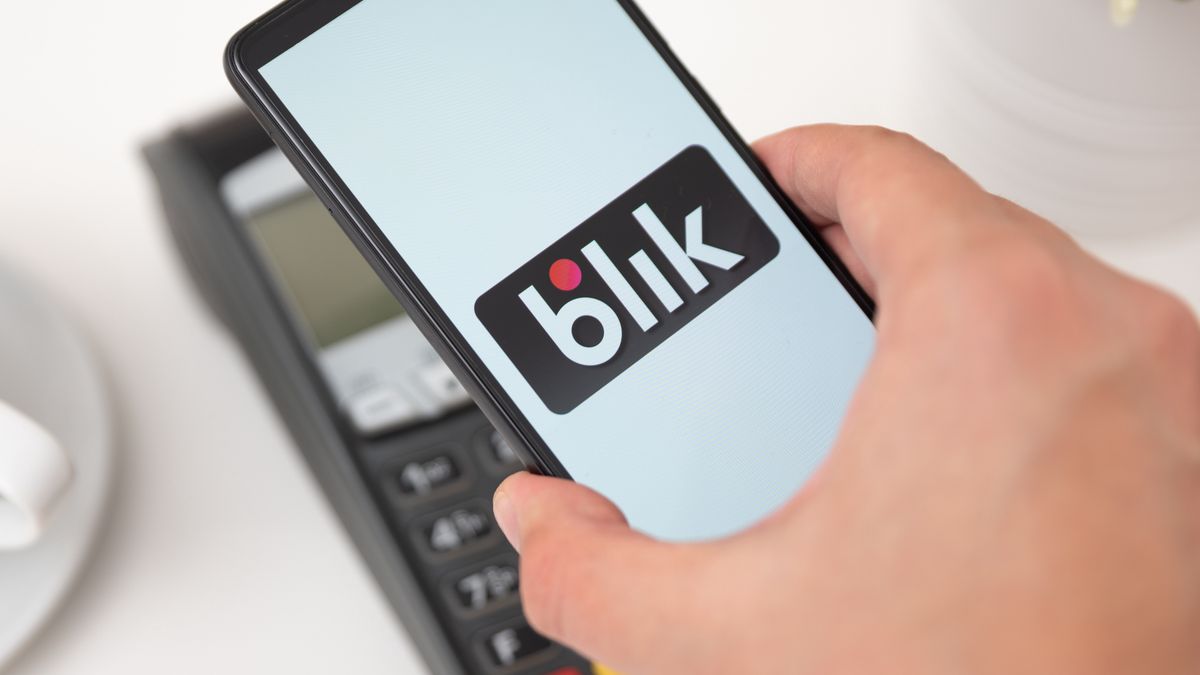 Phone with Blik logo, contactless payment serviceWroclaw, Poland - NOV 06, 2019: Man holding smartphone with Blik logo, contactless payment. Blik is Polish most popular quick payment method in Poland.blik, payment, polish, method, quick, code, money, withdrawal, pos, terminal, cashless, nfc, finance, online, shopping, pay, security, service, popular, poland, smart, phone, hand, holding, digital, modern, effective, mobile, application, logo, screen, content, cash, safety, illustrative, editorial, blik, payment, polish, method, quick, code, money, withdrawal, pos, terminal, cashless, nfc, finance, online, shopping, pay, security, service, popular, poland, smart, phone, hand, holding, digital, modern, effective, mobile, application, logo, screen, content, cash, safety, illustrative, editorial
