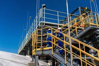 Workers on top of a refrigerated propane storage tank at the AltaGas Ridley Island Propane Export Terminal near Prince Rupert, British Columbia, Canada, on Wednesday, July 16, 2025. The facility is Canada's first propane export facility and the closest North American LPG terminal to Asia. Photographer: James MacDonald/Bloomberg via Getty Images