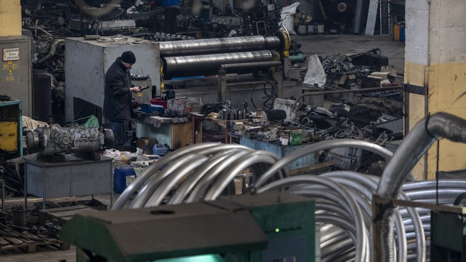 EASTERN UKRAINE - FEBRUARY 13:  A Ukrainian mechanic works on parts to repair and modify captured Russian vehicles to be used by Ukrainian forces on February 13, 2023 at a warehouse in eastern Ukraine. The Ukrainian crowdfunding organization Serhiy Prytula Charity Foundation funds the facility which refurbishes tanks and armored vehicles captured on the battlefield from retreating Russian forces. Such "trophy" vehicles have been crucial to resupply Ukrainian forces who often rely on older Soviet-era fleets, increasingly augmented by newer western weapons systems. (Photo by John Moore/Getty Images)