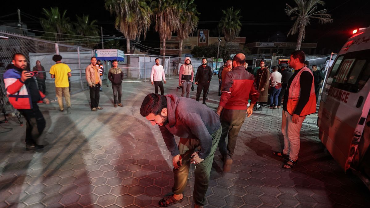 DEIR AL-BALAH, GAZA - MARCH 18: A Palestinian man mourns while injured Palestinians, including children and women are being brought to the Al-Aqsa Martyrs Hospital for treatment as Israel launches 'large-scale' air strikes across Gaza Strip, in Deir Al Balah, Gaza on March 18, 2025. (Photo by Ali Jadallah/Anadolu via Getty Images)
