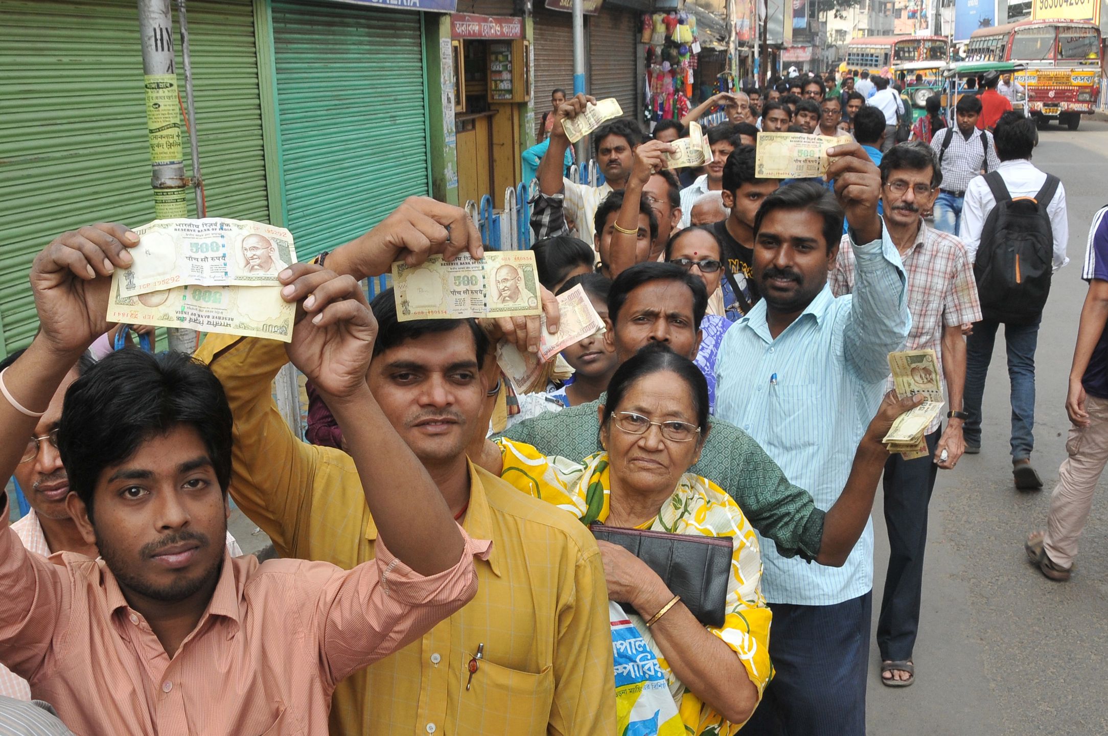Scenes at Indian Banks in Kolkata
Indian Showing 1000 and 500 rupee and   long time waiting  a long line  Many Deposit and change old to new currency at Front of STATE BANK OF INDIA (SBI) - Salkiya HOWRAH Branch ,in Kolkata, India, on 10 November 2016  at 11.10AM. Bank not to open .In a surprise announcement late Tuesday, Prime Minister Narendra Modi banned 500-rupee ($7.50) and 1,000-rupee notes effective midnight, sweeping away 86 percent of total currency in circulation. In panic people flocked to their nearest ATMs, Petrol Pumps and Railway station to get change cash. (Photo by Debajyoti Chakraborty/NurPhoto via Getty Images)
NurPhoto
Banking, Central Bank, Economy, Finance and Economy, Headquarters, Horizontal, India, Indian Subcontinent Ethnicity, New Delhi, Paper Currency, People, Photography, Reserve Bank of India