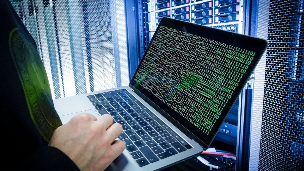 Online Crime
BERLIN, GERMANY - JANUARY 12: Symbolic photo with topic online crime, data theft and piracy: A man poses with a laptop showing a binary code in front of Server racks in a server center on January 12, 2018, in Berlin, Germany. (Photo Illustration by Thomas Trutschel/Photothek via Getty Images)
Thomas Trutschel
Horizontal, Economy, Business and Finance, Computing and Information Technology, IT, IT Service, Colocation, Colocation Center, Colocation Centre, Datacenter, Datacentre, Colo, Data Processing Center, Internet, Sever, Server Room, Communication, Network, Data Transfer, Security, Telecommunication, Data Privacy, Data Security, Data Protection, LED, Light, Server, server cabinet, Server rack, Server racks, Crime, Law and Justice, Technology, Online, Laptop, Criminal, Data Theft, Piracy, Computer, Data Piracy