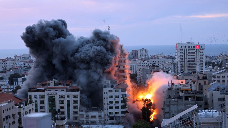 GAZA STRIP, GAZA - OCTOBER 07: Smoke and flames rise after Israeli air forces targeting a shopping center in Gaza Strip, Gaza on October 07, 2023. Declaring a "state of readiness" for war, the Israeli army launched counterattacks and air strikes on targets in Gaza after the Palestinian factions in the Gaza Strip fired an intense barrage of rockets early Saturday toward Israel, reports Israel media. (Photo by Mustafa Hassona/Anadolu Agency via Getty Images)