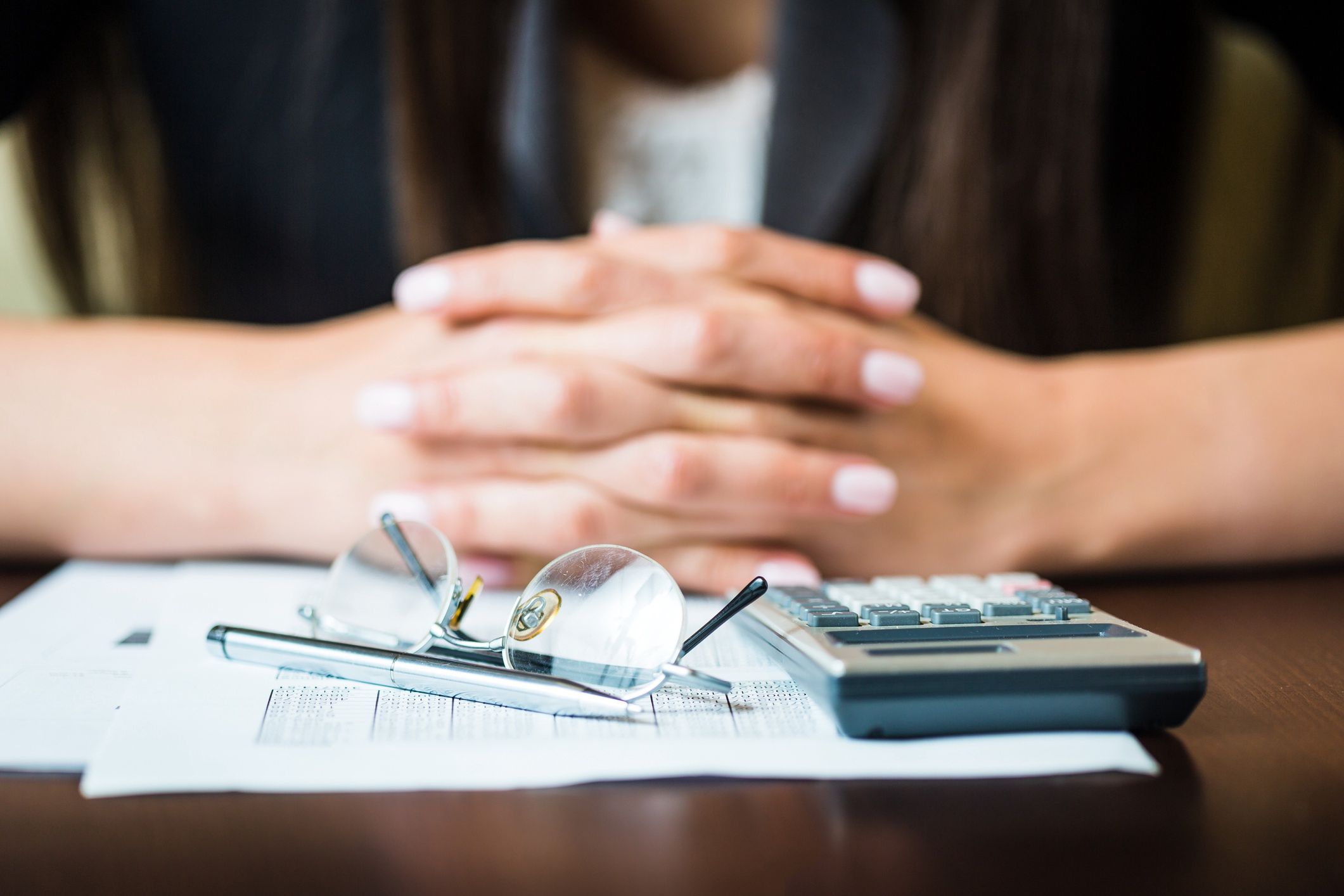 Close up of businesswomans hands with pen, glasses, and calculator doing some financial calculations
Close up of businesswomans hands with pen, glasses, and calculator doing some financial calculations
NoSystem images