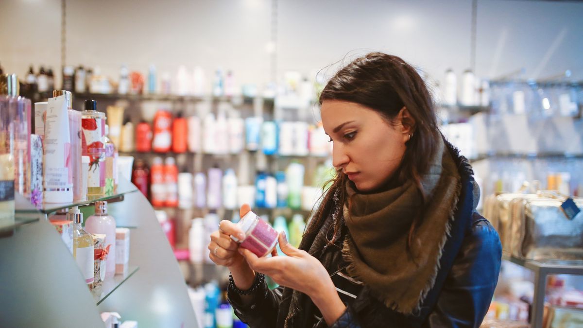 Woman shopping in cosmetics shop
Vintage toned portrait of a young beautiful brunette woman in London cosmetics shop. She is wearing casual clothes, black knitted sweater, looking through the products.
lechatnoir