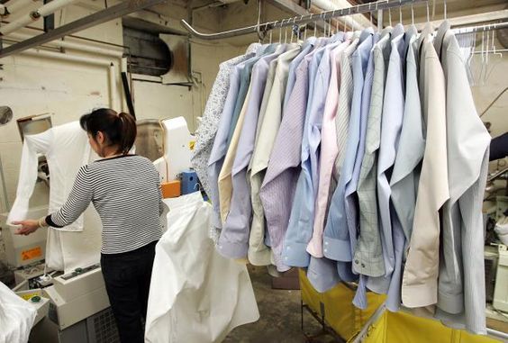 SAN FRANCISCO - JANUARY 29:  A worker at Sohn's French Cleaners, which uses eco-friendly chemicals to dry clean clothes, presses shirts January 29, 2007 in San Francisco. The California Air Resources Board announced last week that it has enacted the nation's first statewide ban on the chemical perchloroethylene, a toxic solvent commonly used by dry cleaners. By 2023, dry cleaning machinery using perchloroethylene, also known as "perc", will be banned from use in the state of California.  (Photo by Justin Sullivan/Getty Images)