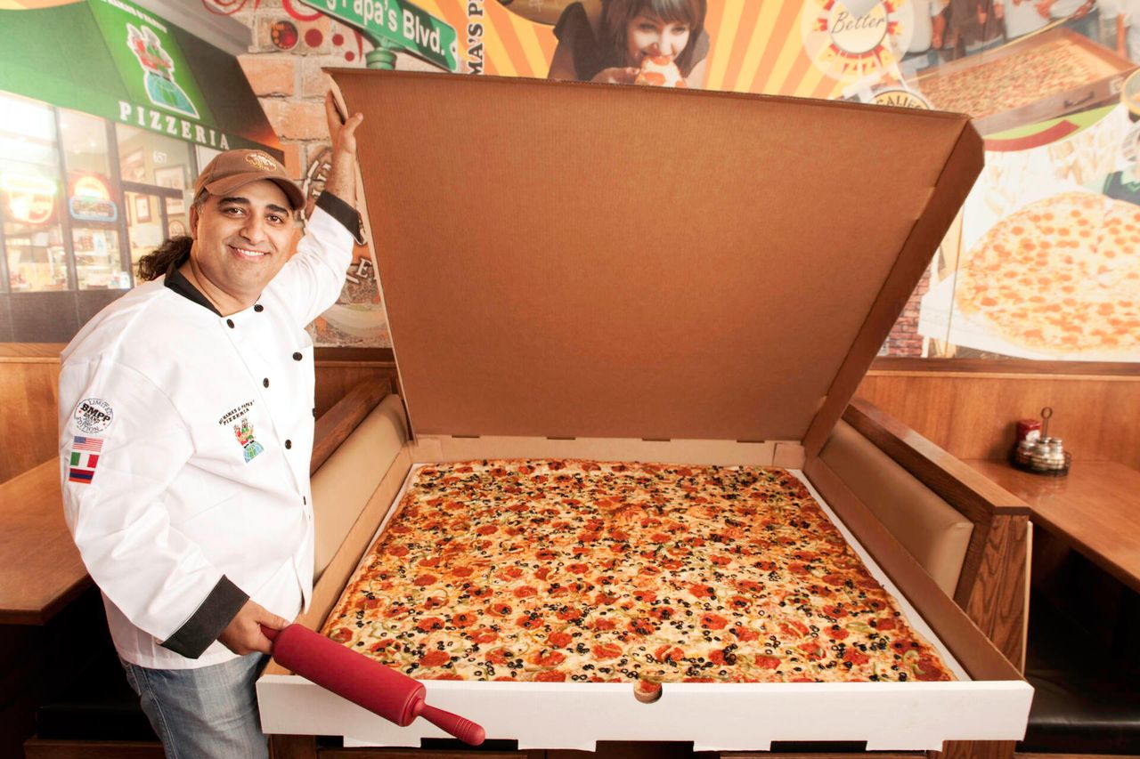 Largest Pizza Commercially Available
Guinness World Records 2010
Photo Credit: Ryan Schude/Guinness World Records
Location: Big Mamas &amp; Papas Pizzeria, Hollywood Boulevard, LA, USA
Pictured: 
Owner - Ararat Agakhanyan