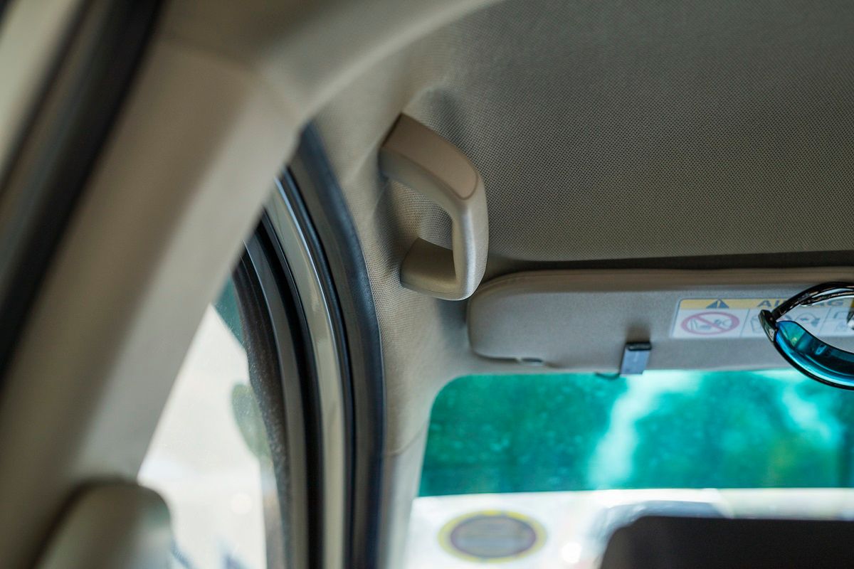 grab handles above the doors in a car, photo by Getty Images