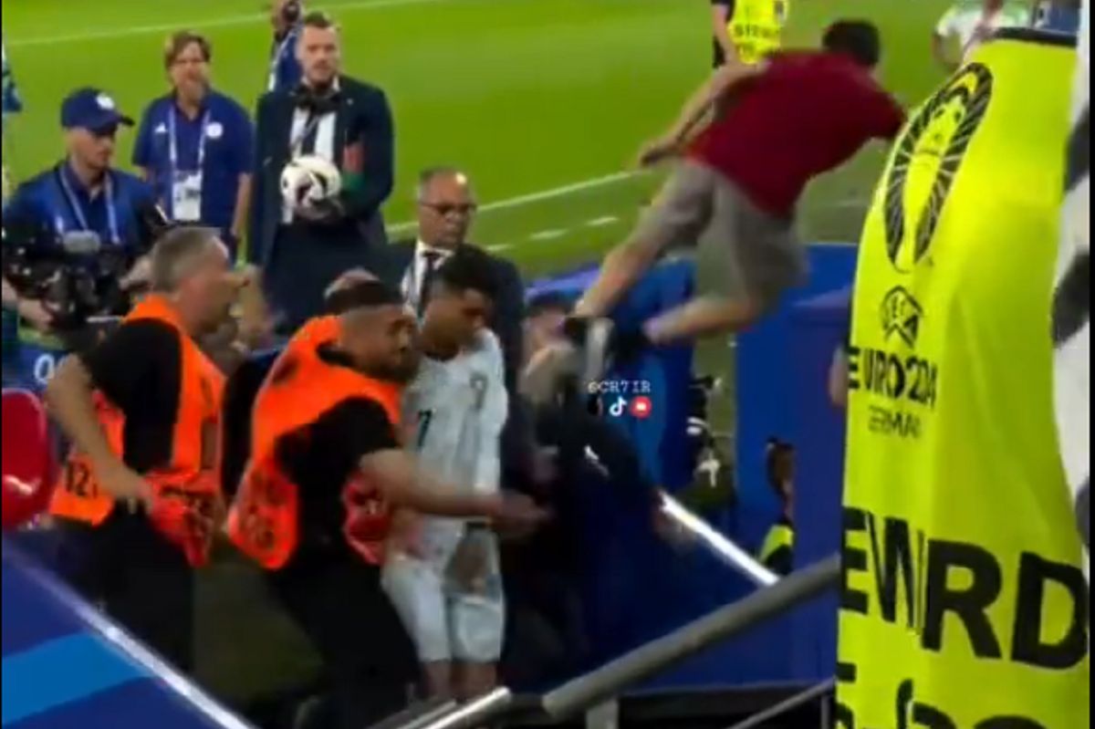 A fan's mad leap towards Ronaldo. It could have been dangerous.